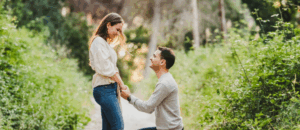 a man on one knee proposing in a garden richmond va