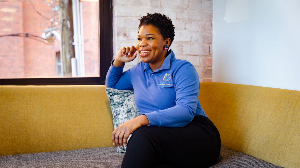 A woman sits on a couch in a Richmond VA local business