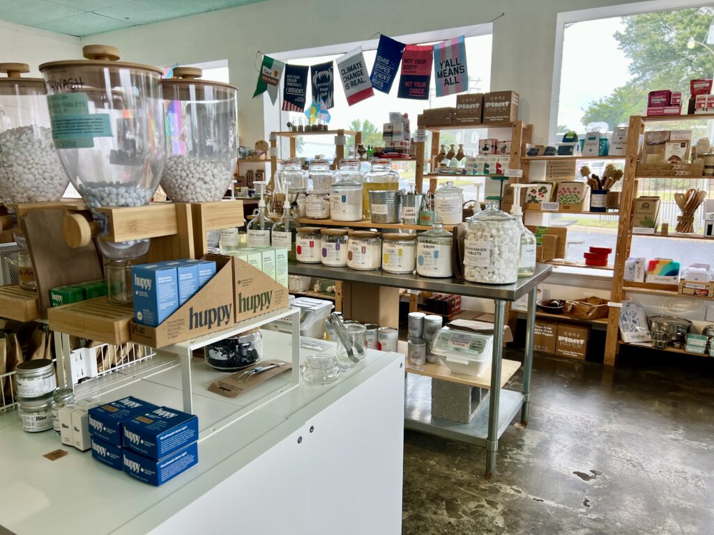 The interior of Eco-Inspired in Bon Air, Richmond, VA with refill bottles and eco-friendly products set along shelves. 